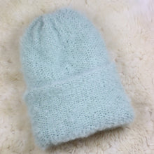 Load image into Gallery viewer, A furry hat with a twist brim