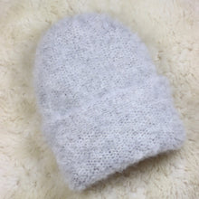 Load image into Gallery viewer, A furry hat with a twist brim