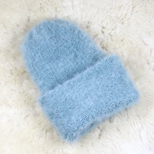 Load image into Gallery viewer, A furry hat with a twist brim
