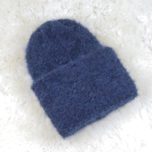 Load image into Gallery viewer, A furry hat with a twist brim
