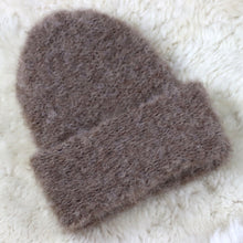 Load image into Gallery viewer, A furry hat with a twist brim
