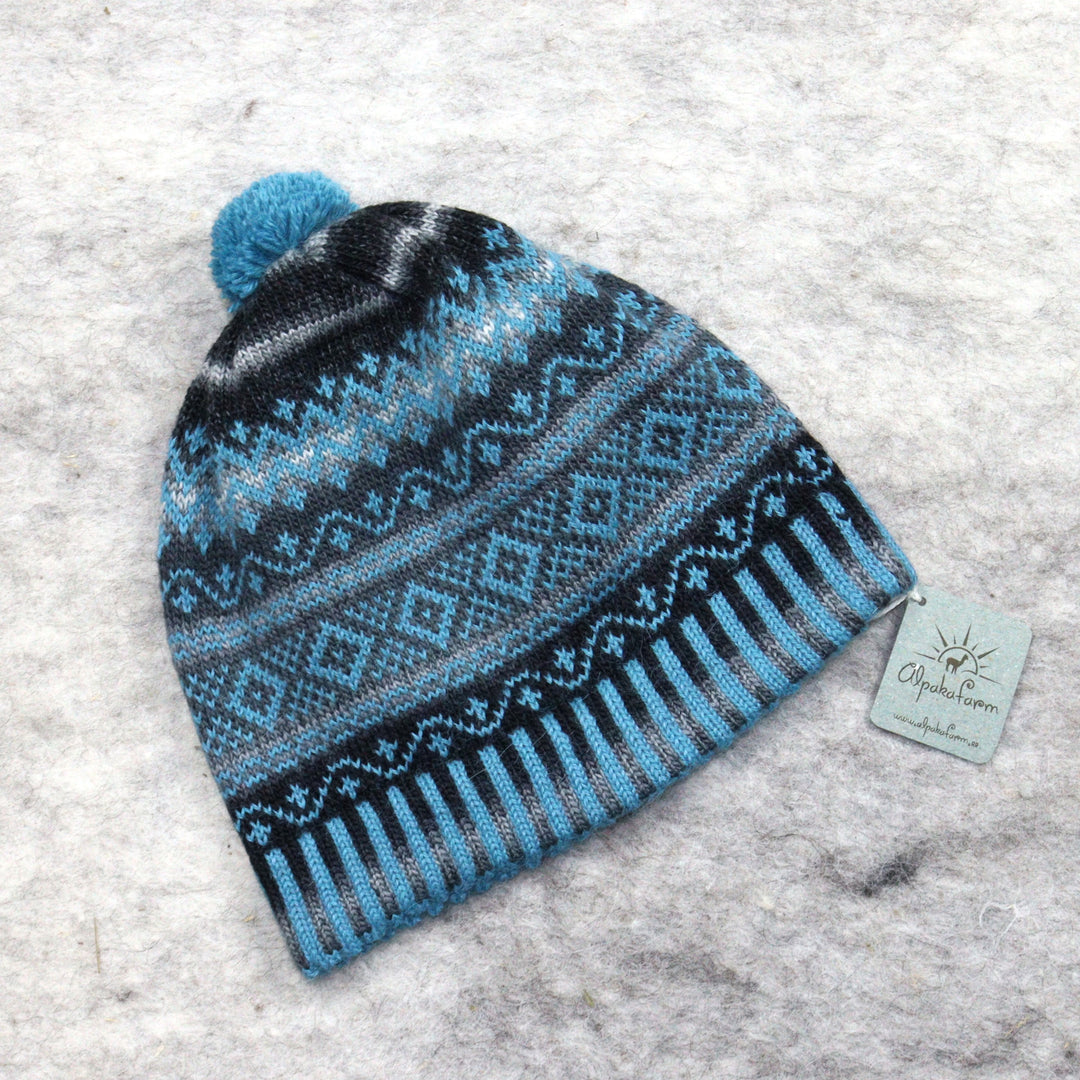 Patterned pom-pom hat