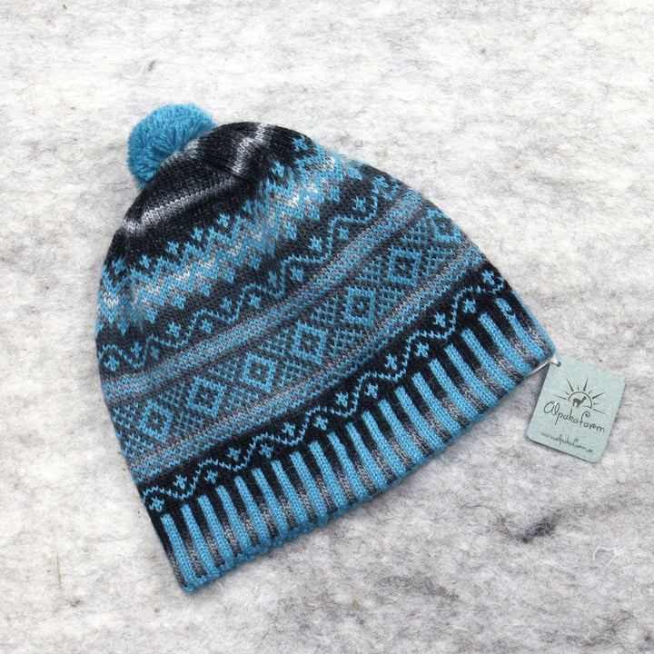 Patterned pom-pom hat