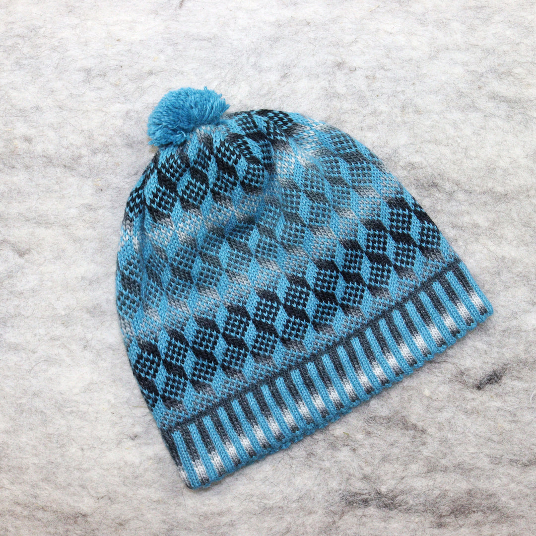 Patterned pom-pom hat