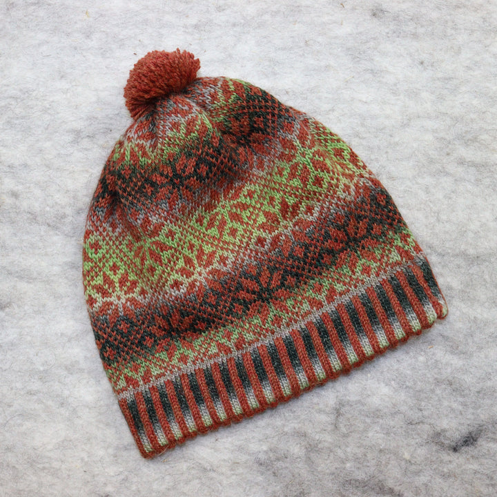 Patterned pom-pom hat