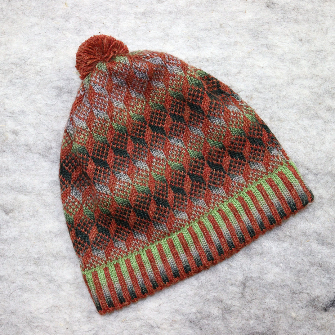 Patterned pom-pom hat