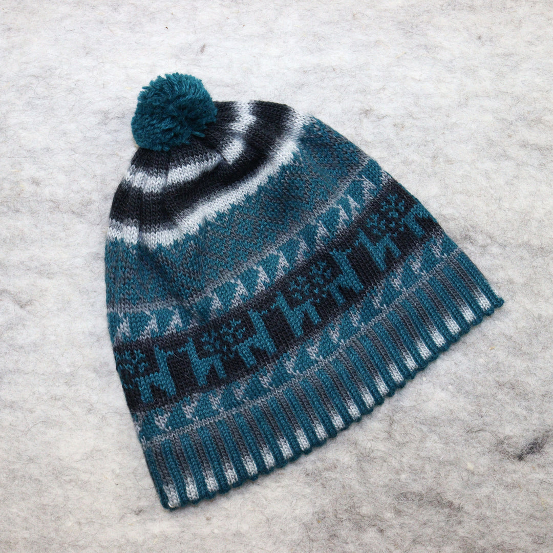 Patterned pom-pom hat