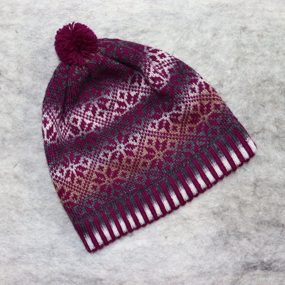 Patterned pom-pom hat