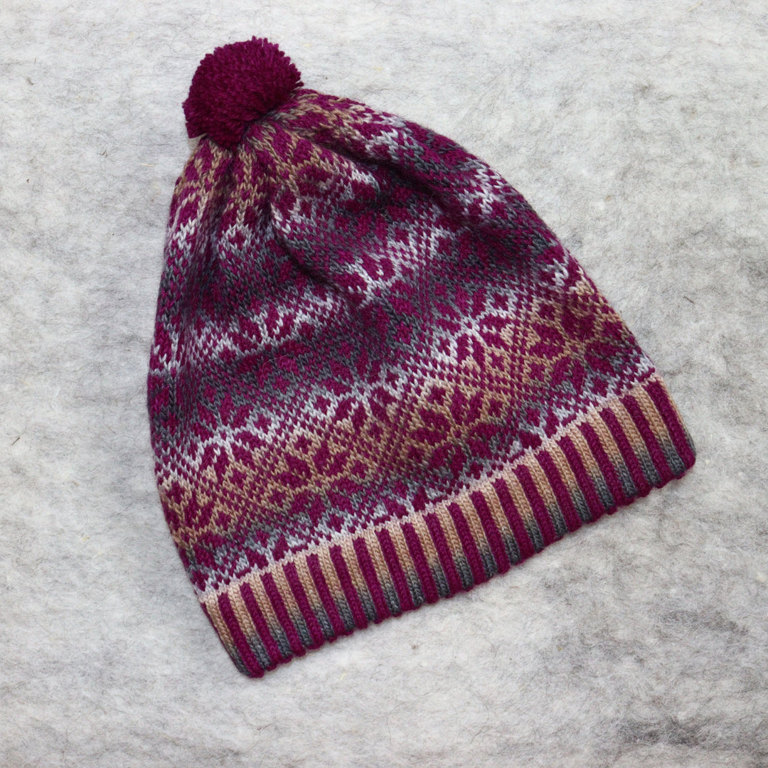 Patterned pom-pom hat