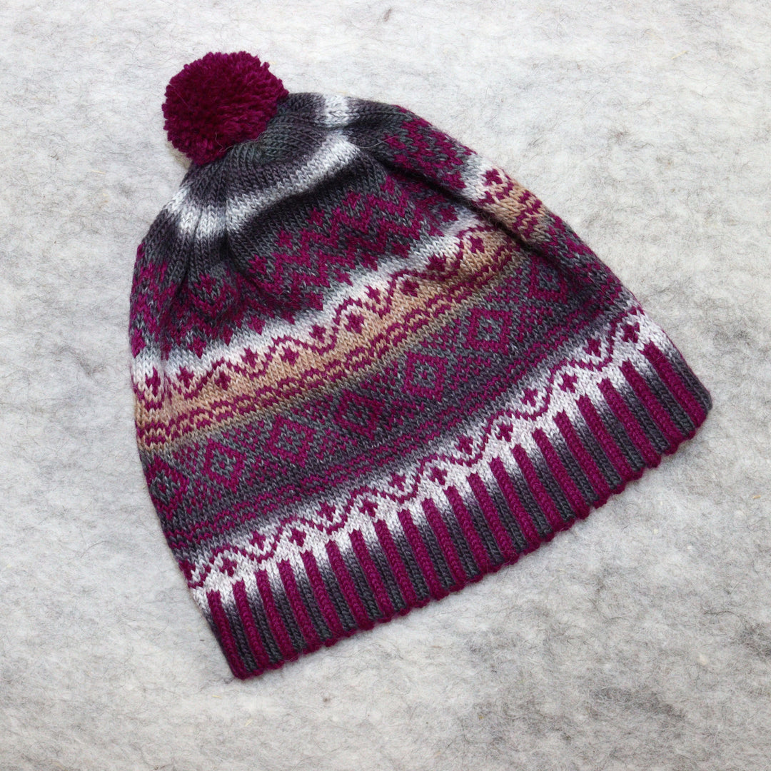 Patterned pom-pom hat
