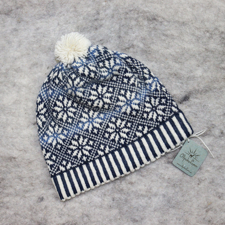 Patterned pom-pom hat