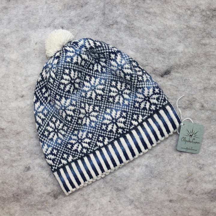 Patterned pom-pom hat