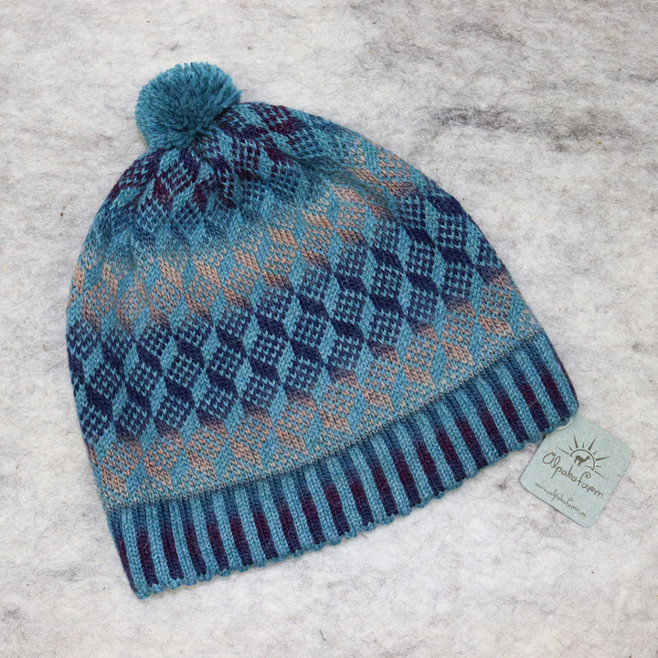 Patterned pom-pom hat