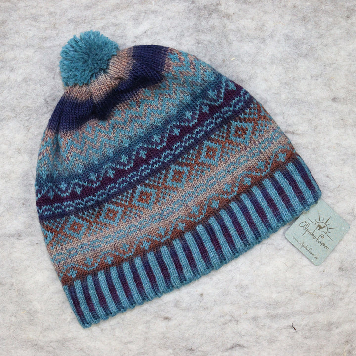 Patterned pom-pom hat