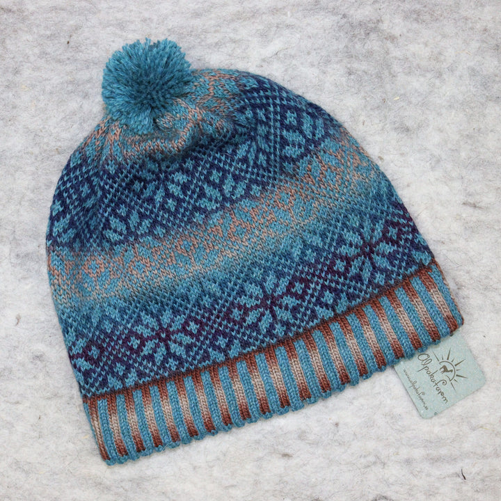 Patterned pom-pom hat