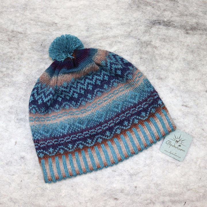 Patterned pom-pom hat