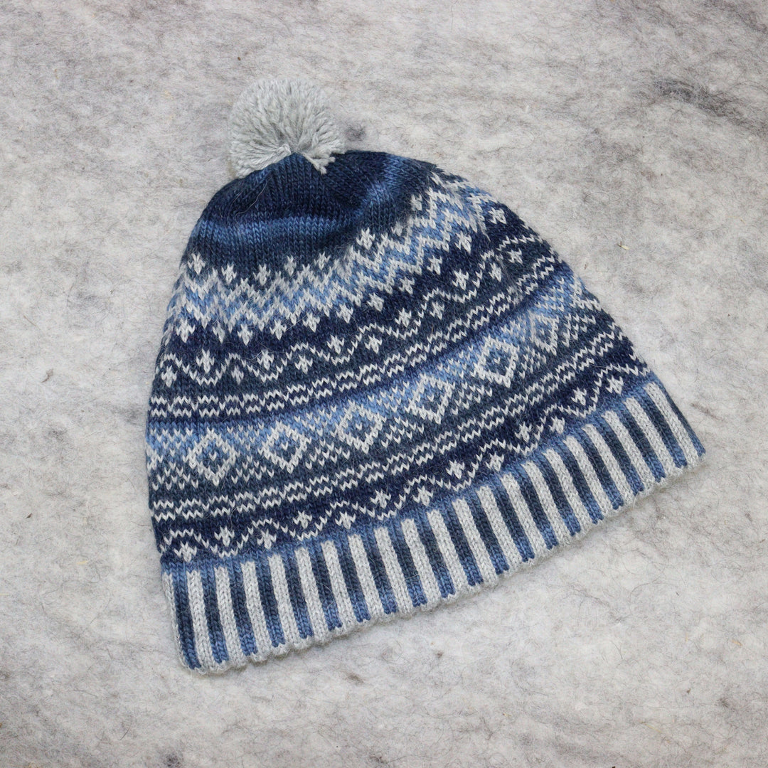 Patterned pom-pom hat