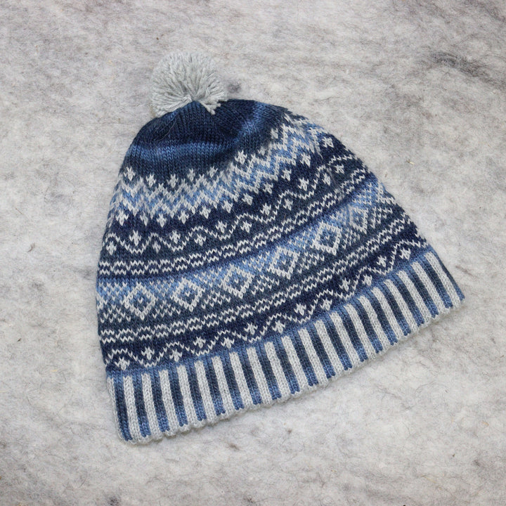 Patterned pom-pom hat