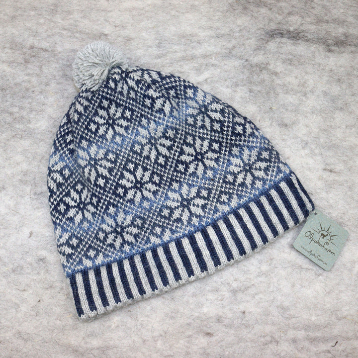 Patterned pom-pom hat