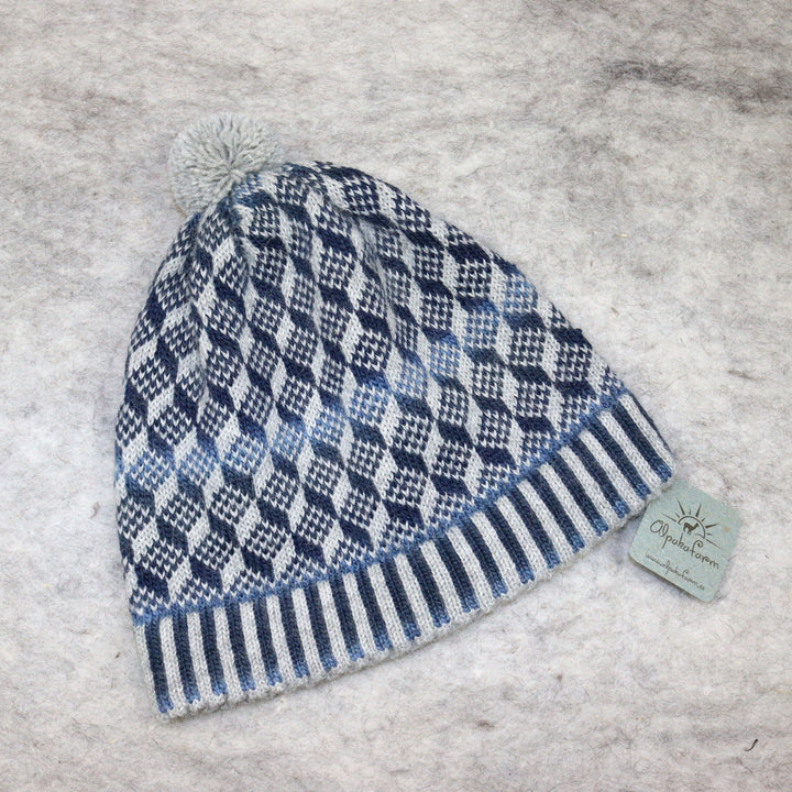 Patterned pom-pom hat