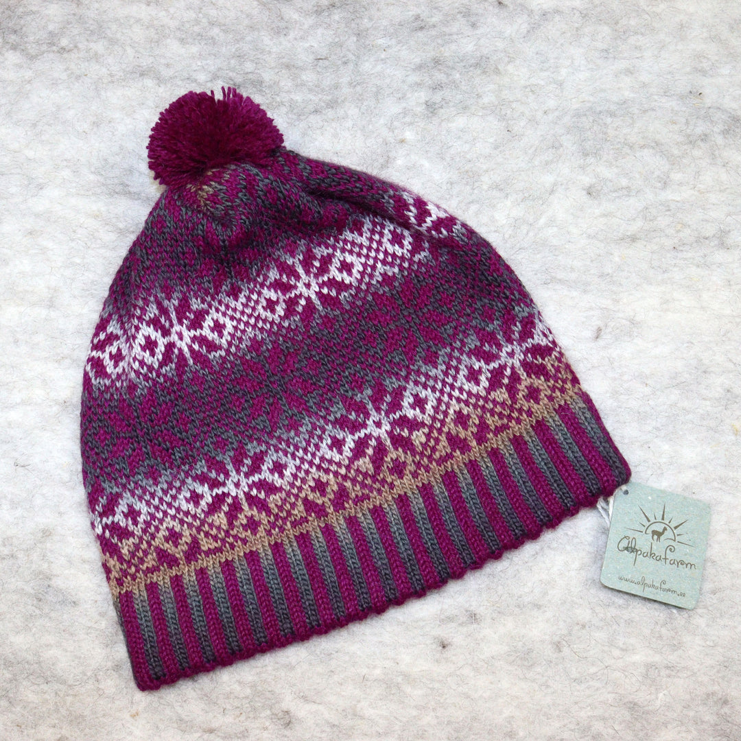 Patterned pom-pom hat