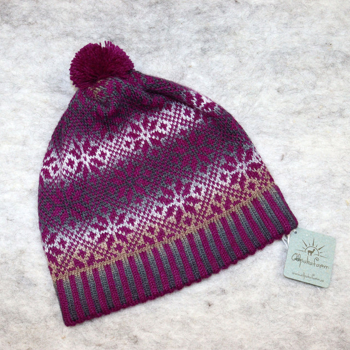 Patterned pom-pom hat