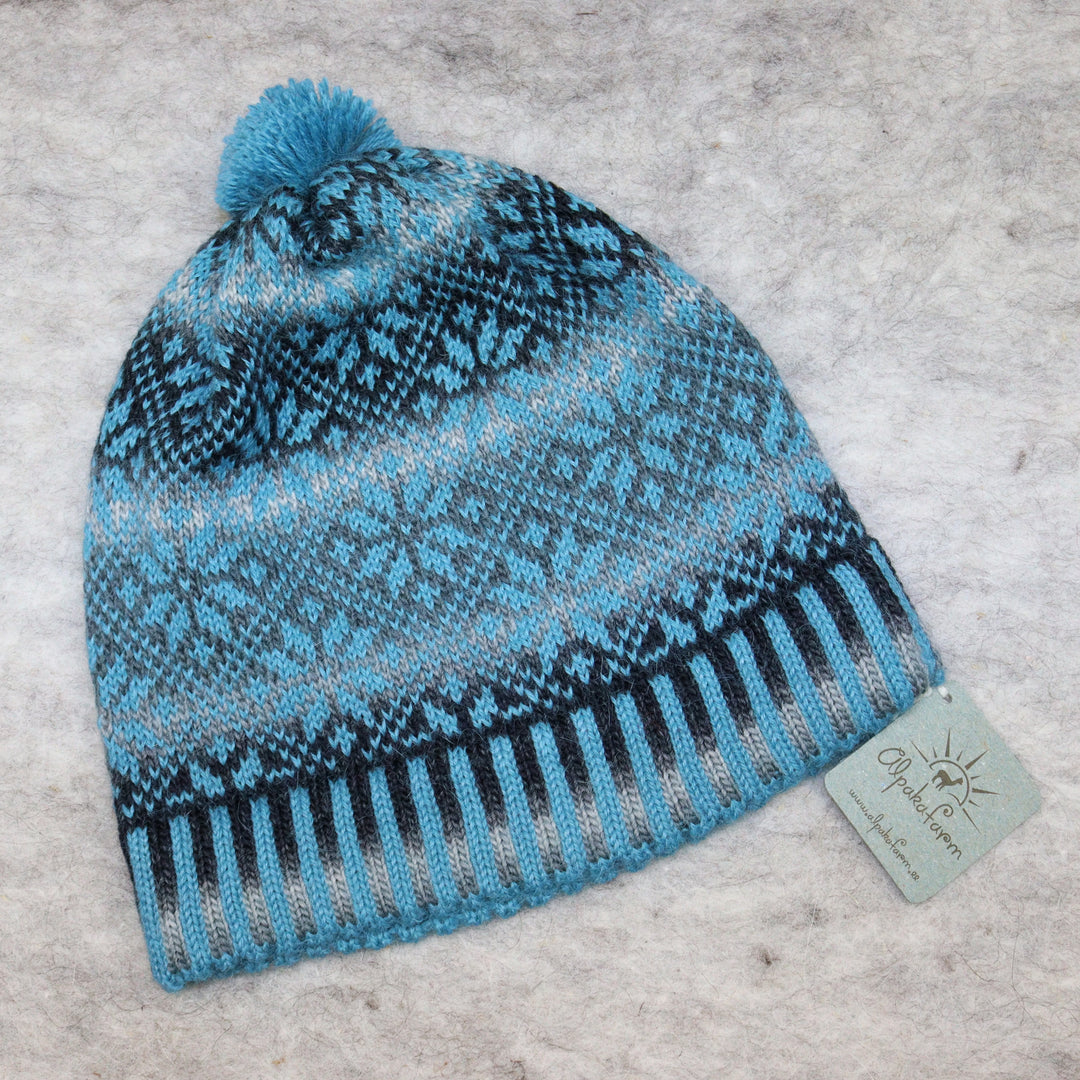 Patterned pom-pom hat