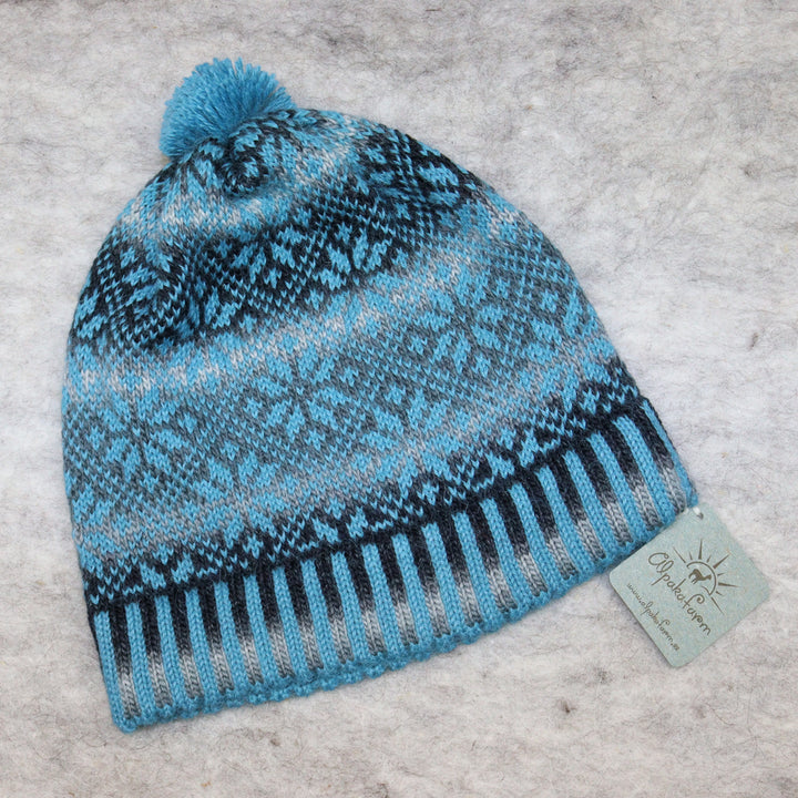 Patterned pom-pom hat