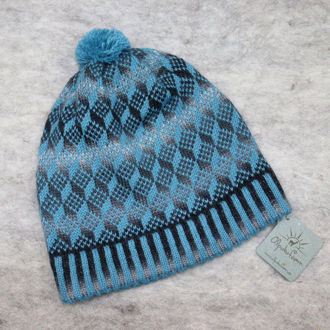 Patterned pom-pom hat