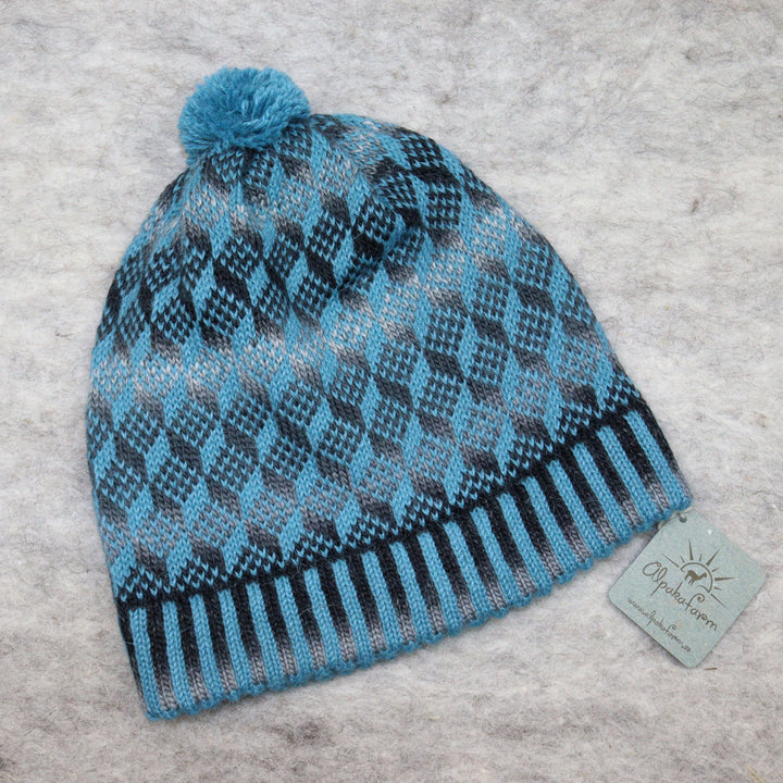 Patterned pom-pom hat