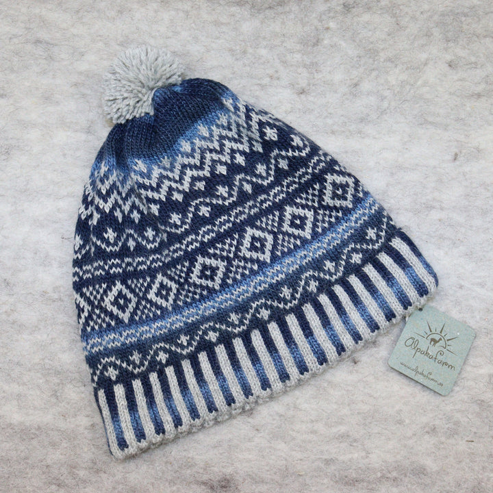 Patterned pom-pom hat