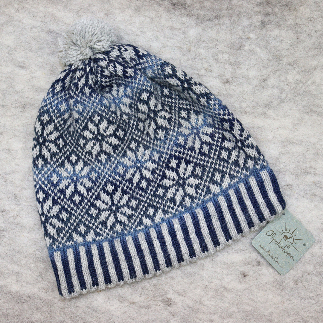 Patterned pom-pom hat