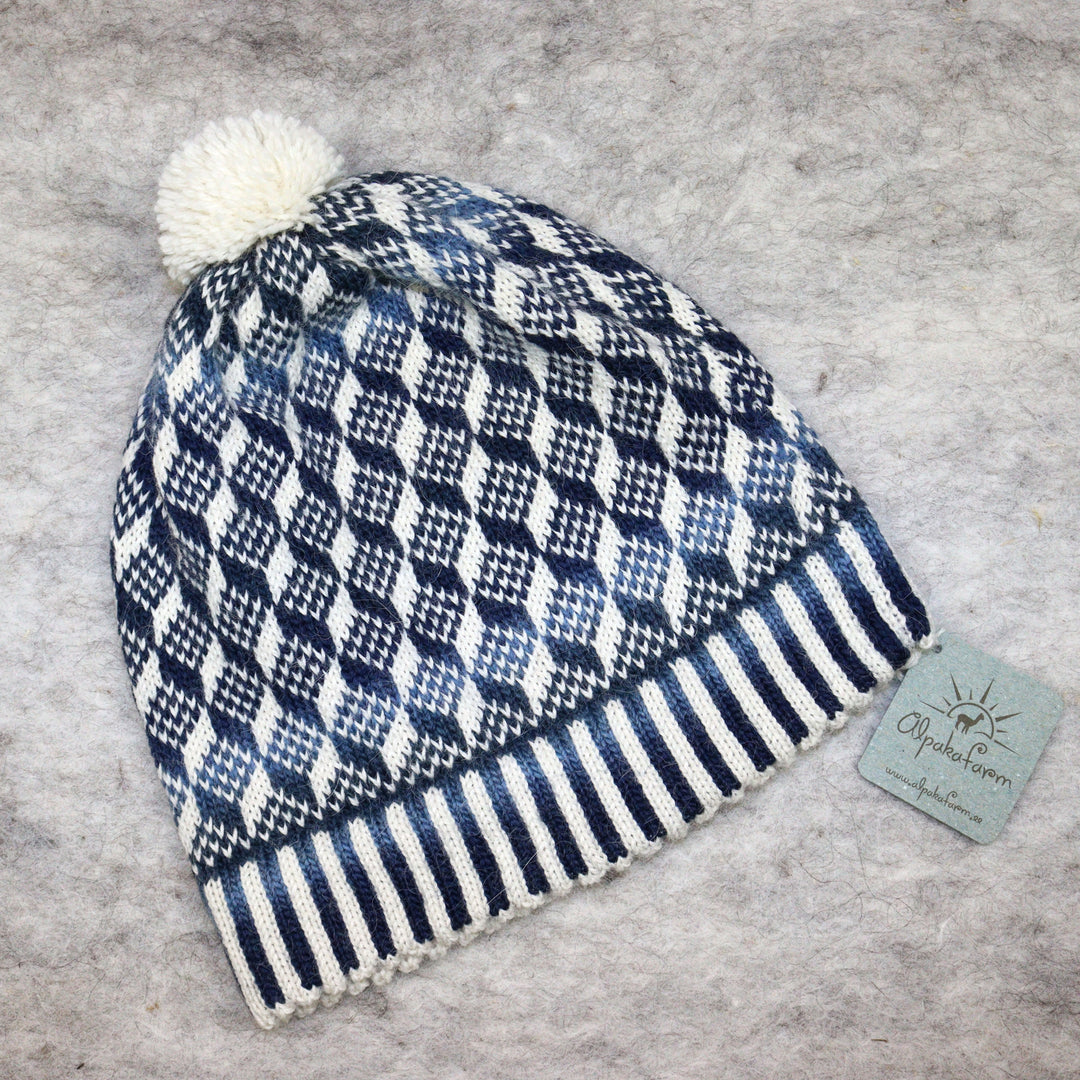Patterned pom-pom hat