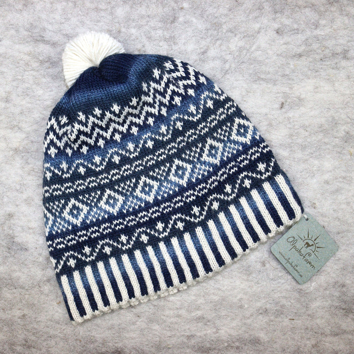 Patterned pom-pom hat