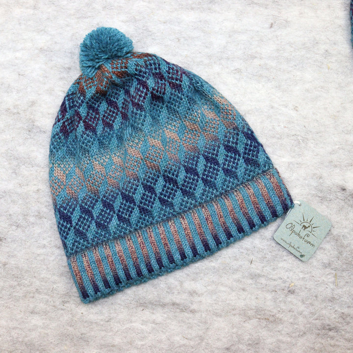 Patterned pom-pom hat