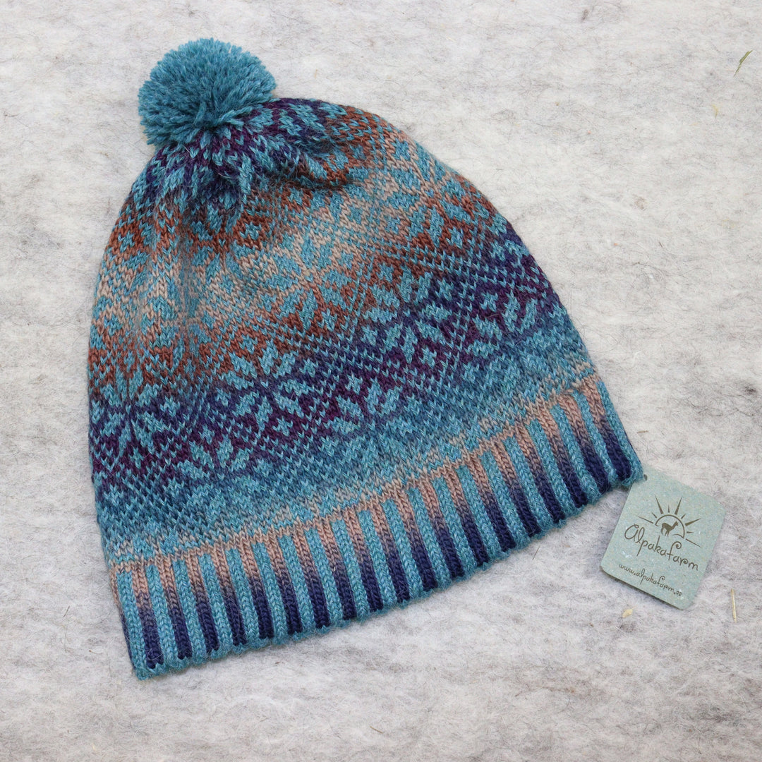 Patterned pom-pom hat