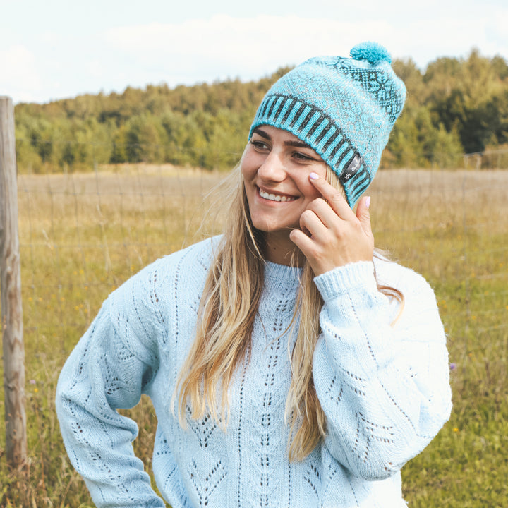 Patterned pom-pom hat